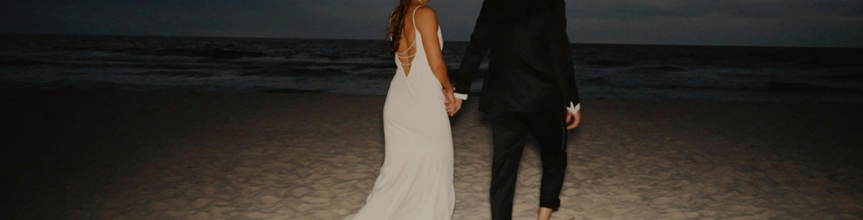 Photo of bride and groom on the beach